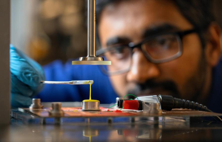 PhD student Prateek Sehgal works with shear thickening fluid in their Clark Hall lab.